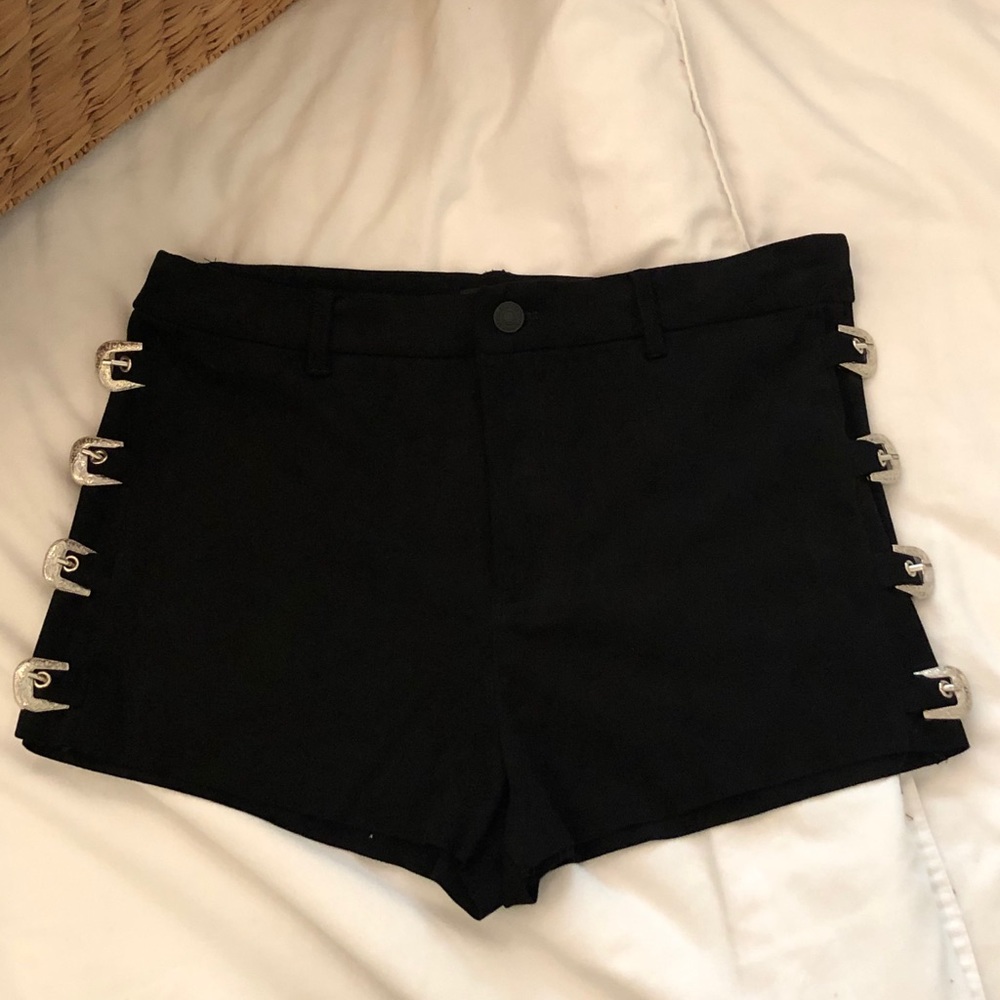 Black suede shorts with silver buckles